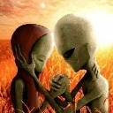 Two green aliens holding hands and embracing in a warm, orange-toned field.