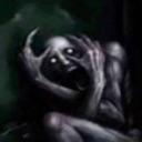 A pale, gaunt monster with glowing eyes clutching its head in a state of extreme panic.