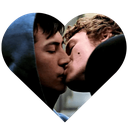 Two men kissing inside a heart-shaped frame.