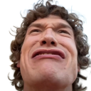 Man with curly hair making a pained, cringing facial expression.