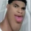 Man with an extremely distorted, elongated jawline looking into the camera with a confused expression.