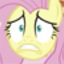 Fluttershy the yellow pony with a panicked, wide-eyed expression and trembling mouth.