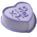 Purple heart-shaped candy with the text Kiss Me embossed on the surface.