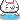 A small white pixel creature with a happy face swimming in blue water.