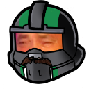 A man with a mustache looking tired from behind a green and black tactical helmet visor.