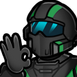 A soldier wearing a tactical helmet and visor makes an OK hand gesture.