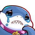 A cartoon blue shark with a purple collar and gold tag crying large tears.