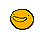 Yellow blob character with a lopsided, mischievous grin.