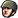 A soldier wearing a military helmet looking forward with a serious expression.