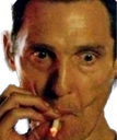 Matthew McConaughey looking intensely stressed while holding a cigarette.