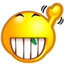 Yellow smiley face with a wide, toothy grin and a small green leaf stuck between its front teeth.
