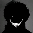 A dark silhouette with a wide, glowing white toothy grin.