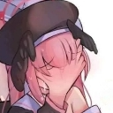 An anime girl with pink hair has her face squished by an unseen hand while blushing intensely.