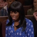 Woman with a wide-eyed, stunned expression looking off to the side.
