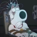 A cartoon dog with wide eyes looks terrified while strapped into a chair with wires attached to its head.