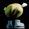 Green character performing a twerking dance move against a black background.