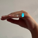 Hand held in a questioning gesture with a small blue droplet icon floating above the fingers.