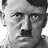 Adolf Hitler with a stern, intense facial expression in a black and white close-up.