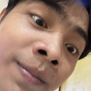 A person's face captured in an extreme close-up with a wide-angle lens effect.