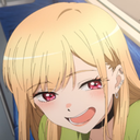 Marin Kitagawa with a mischievous smirk and flushed cheeks.