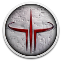 A circular silver metallic plate featuring a sharp, stylized red trident-like symbol in the center.