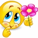 A yellow smiley face with large blue eyes looking bashful while holding a pink flower.