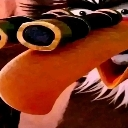 Binoculars held up to eyes in a close-up, distorted perspective shot.