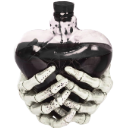 Skeleton hands cupping a dark heart-shaped object.
