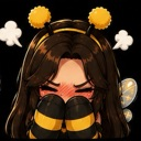 A girl in a bee costume with antennae and wings blushing deeply while hiding her face with her hands.