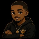 A young man with a goatee wearing a black hoodie and gold bee necklace with his arms crossed.