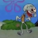 Squidward with wide eyes and a gaping mouth laughing hysterically.