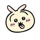A round, light yellow creature with long ears and a wide, goofy smile sticking its tongue out.
