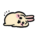 A cute yellow rabbit lying flat on its stomach with a tired expression.