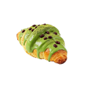 A croissant topped with green matcha glaze and chocolate chips.