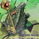 A green turtle standing upright and holding a large golden key with a red gem in its hand.