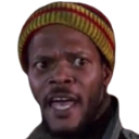 A man wearing a red and yellow beanie looking shocked and confused with his mouth open.