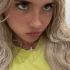 A blonde woman progressively scrunching her face in a four-panel sequence to show annoyance.