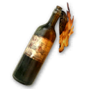 A glass bottle filled with liquid and a burning rag wick, engulfed in flames against a black background.