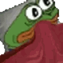 A green frog character peeking out from under a red blanket with a cozy expression.