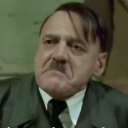 A man with a mustache making an intense, angry, and frustrated facial expression.