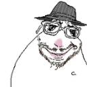 A smug man wearing a fedora and glasses with a slight smirk.