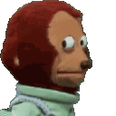 Monkey puppet looking sideways with a suspicious and awkward expression.