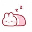 A small, pink and white cartoon bunny lying down with its eyes closed and two Zs floating above its head.