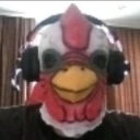 A person wearing a white and red chicken mask with a yellow beak and large black headphones.