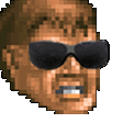 A pixelated human face wearing black sunglasses with a smug, unbothered expression.