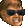 A pixelated man with brown hair and sunglasses looking angry with gritted teeth.