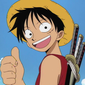 Monkey D. Luffy smiling and giving a thumbs up gesture.