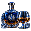 A blue crown-topped bottle of amber liquid sits next to a snifter glass filled with spirit and ice cubes.