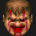 Human face with a wide, menacing grin and blood streaming from the eyes.