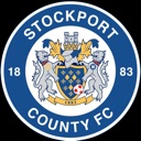 Stockport County FC crest featuring a shield with lions and text in a blue circle.
